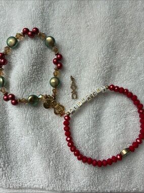Two Alpha Chi Omega bracelets and one  gold AXO Lavalier